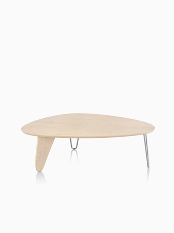 A Noguchi Rudder Table with a light wood finish.
