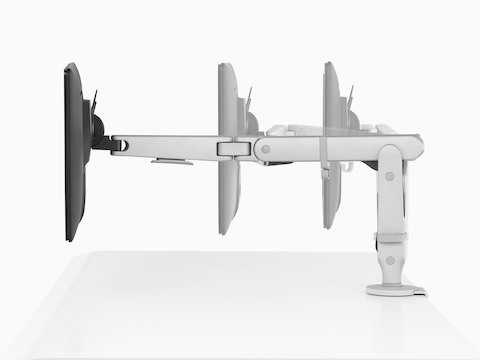 Profile view of an adjustable Ollin Monitor Arm positioning a monitor at three different focal distances.