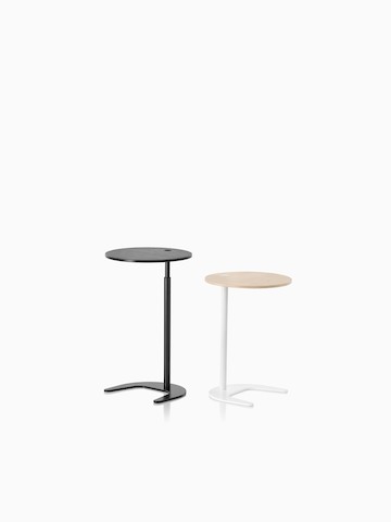 Two Plex work tables—one black and one with a white base and tan top.
