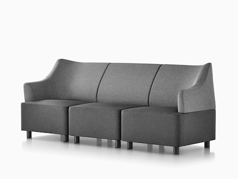 A gray Plex sofa formed from three modular elements. 