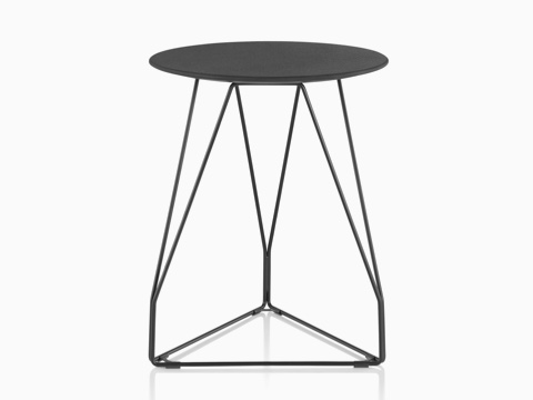 A round Polygon Wire occasional table with a black top and wire base.