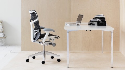 A modern home office featuring a Mirra 2 office chair and an Everywhere Table.