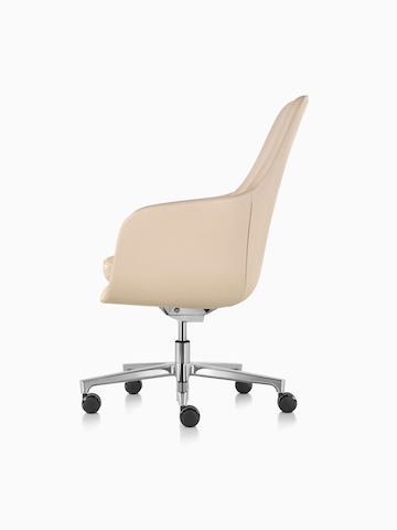 Profile view of a high-back Saiba executive chair in tan leather with a polished five-star base and casters.