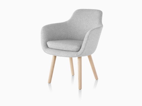 A light gray Saiba Side Chair, featuring an upholstered bucket seat and wood legs, viewed from a 45-degree angle.