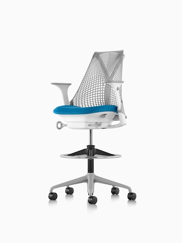 Light gray Sayl Stool with a blue seat, viewed from a 45-degree angle.