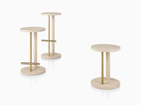 Family of Spot Stools in white ash with brass finish, viewed at an angle.