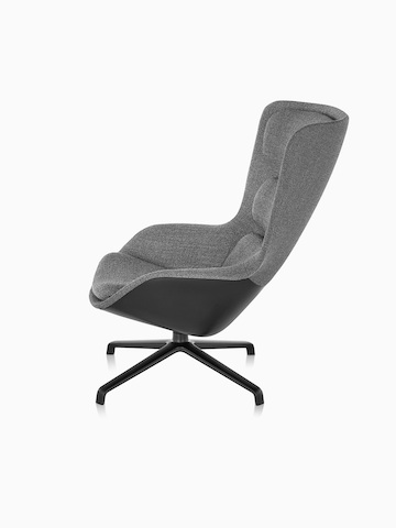 Side view of high-back Striad Lounge Chair in gray upholstery with four-star base.