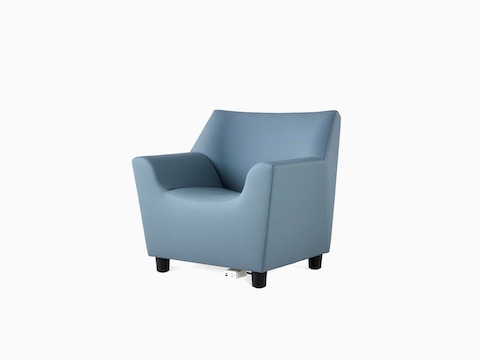 A Swoop Club Chair in a blue upholstery, with an optional power unit and housing, viewed at an angle. Power features USB-C port, USB-A port, and one A/C electrical outlet.