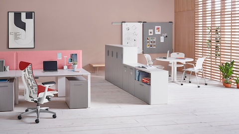 Tu storage components create a boundary between individual workstations and a collaboration zone.