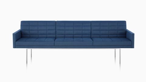 A three-seat Tuxedo Component Sofa with a metal base and quilted upholstery.