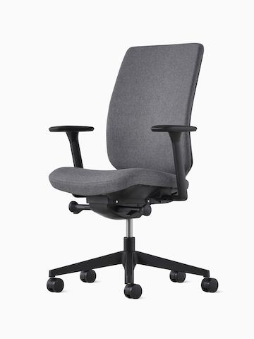 A Verus Chair with a dark gray upholstered seat and dark gray upholstered back.