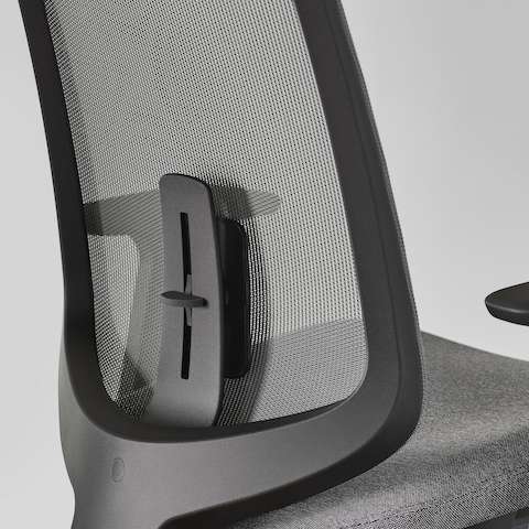 A close-up view of a Verus Chair with a black suspension back and adjustable lumbar support.
