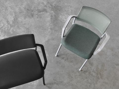 An overhead view of a black Verus Side Chair next to a green Verus Side Chair.