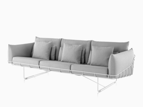 Gray three-seat Wireframe Sofa with white frame, viewed from an angle.