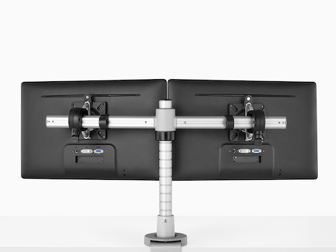 Rear view of two side-by-side monitors attached to a single Wishbone Monitor Arm post.