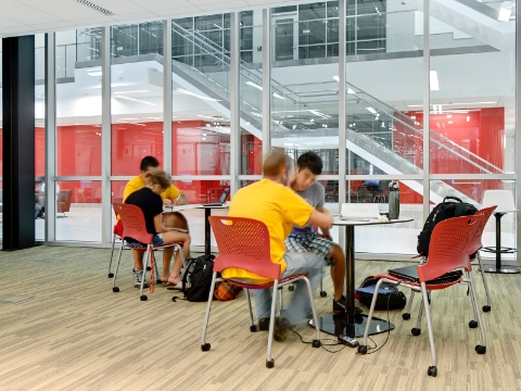 College students study while seated in Caper chairs. 