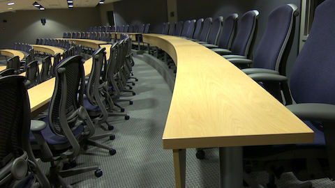 A forum inside K-state Olathe outfitted with curved tables and Celle chairs. 