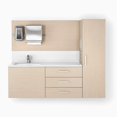Mora System casework in an ash finish and a white solid surface top and sink. The casework is wall-hung and has 3 drawers and one storage tower.