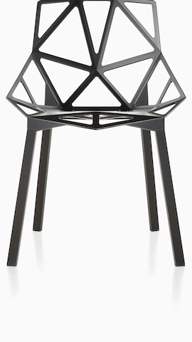 Partial view of a Black Magis Chair_One side chair with a stackable four-leg base, viewed from the front. Select to see outdoor chairs available from the Herman Miller store. 
