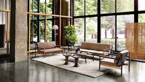 A contemporary waiting area featuring a Brabo Lounge Seating settee, sofa, and chair.