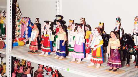 Colorful figurines from Alexander Girard's folk art collection. Select to go to an article about the Girard Wing at the Museum of International Folk Art.