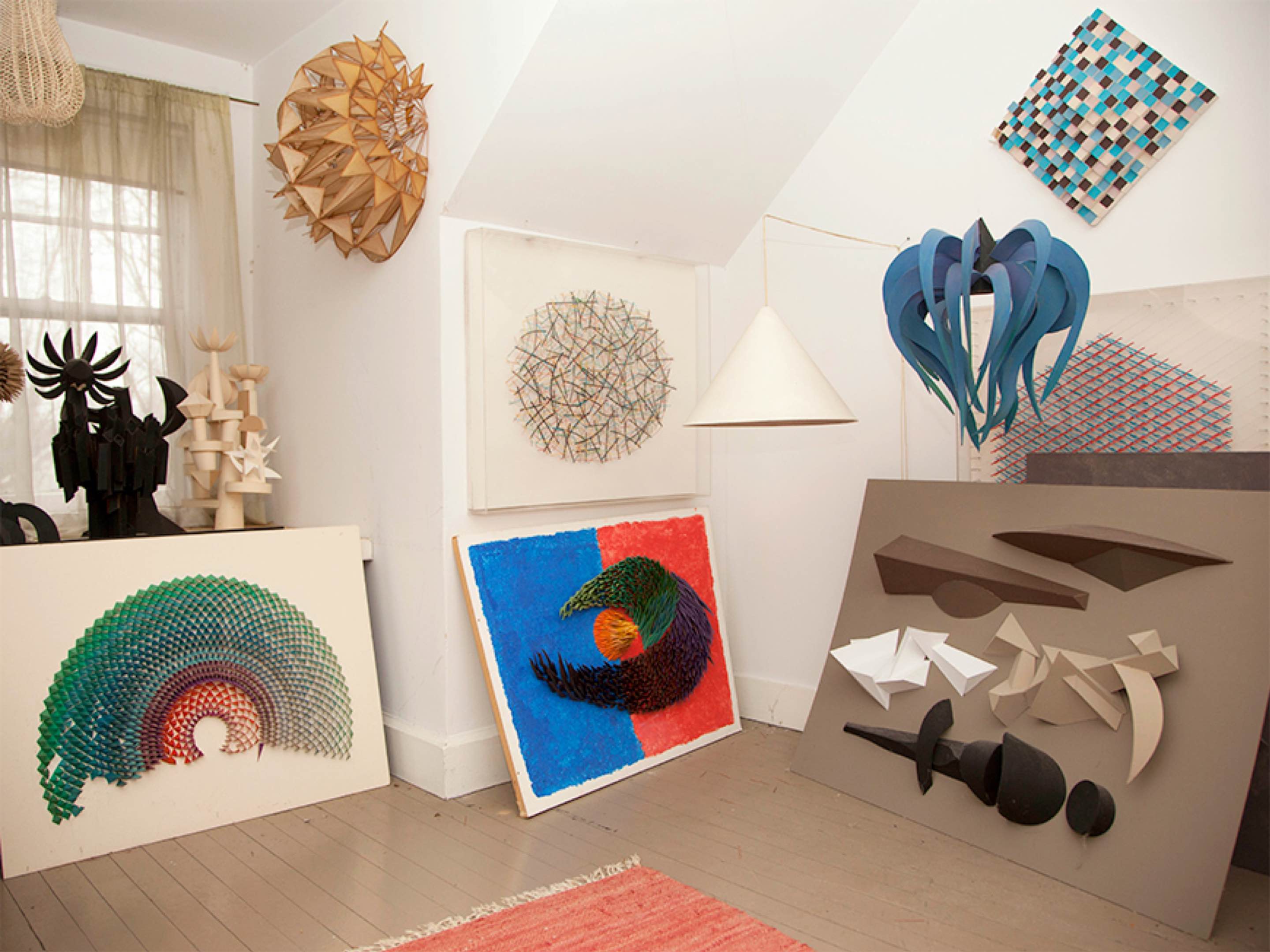 Various pieces of artwork on display in designer Irving Harper's home.