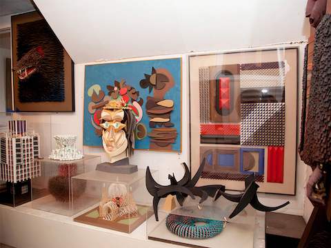 Sculptures created from various media on display in designer Irving Harper's home.
