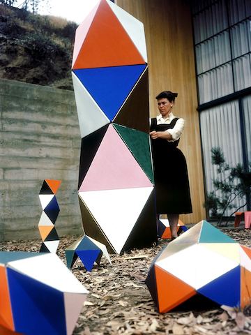 Ray Eames plays with an early prototype of The Toy outside the Eames House in 1951.