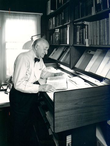 Herman Miller founder D.J. De Pree reads in his home office.