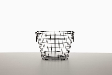 An empty black wire basket.