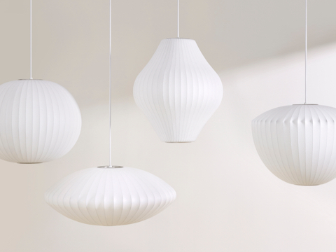 Four white hanging Nelson Bubble Lamps.