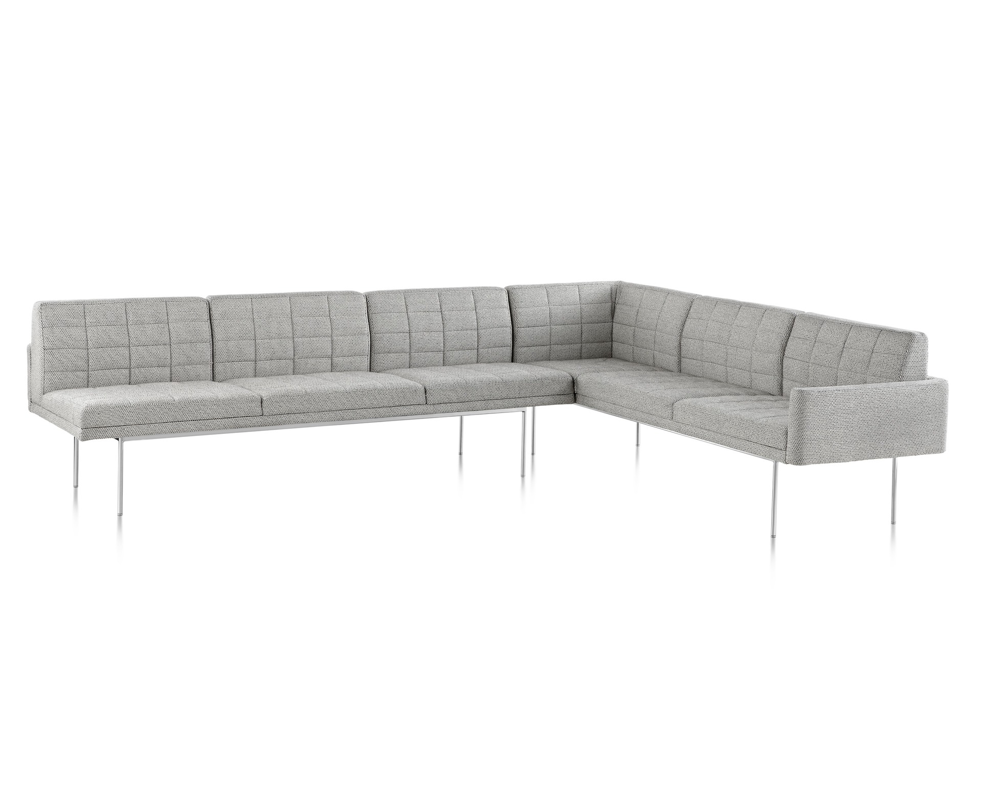 A Tuxedo Component Sofa corner unit with a metal base and quilted upholstery.