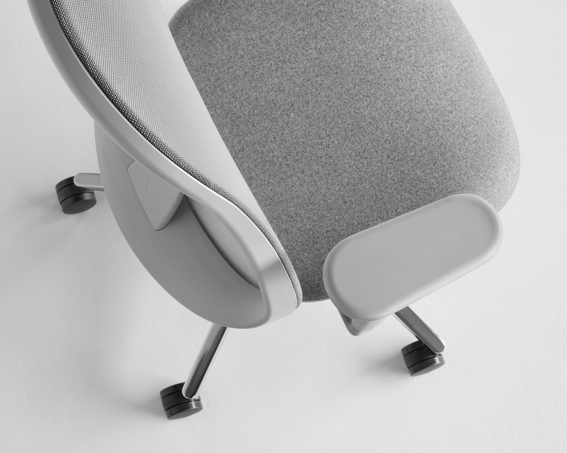 Grey Lino Chair with polished aluminum base, viewed from a top down angle. 