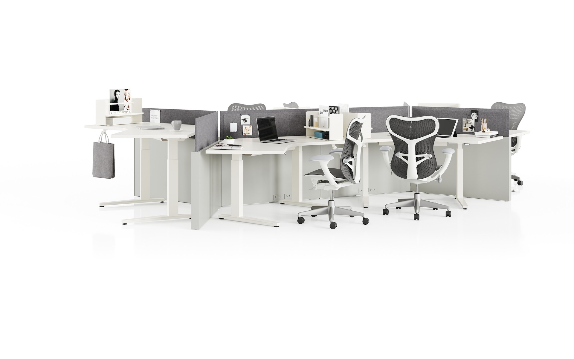 Grey Canvas Channel workstations with white sit-to-stand tables, grey screens, and Mirra 2 Chairs.
