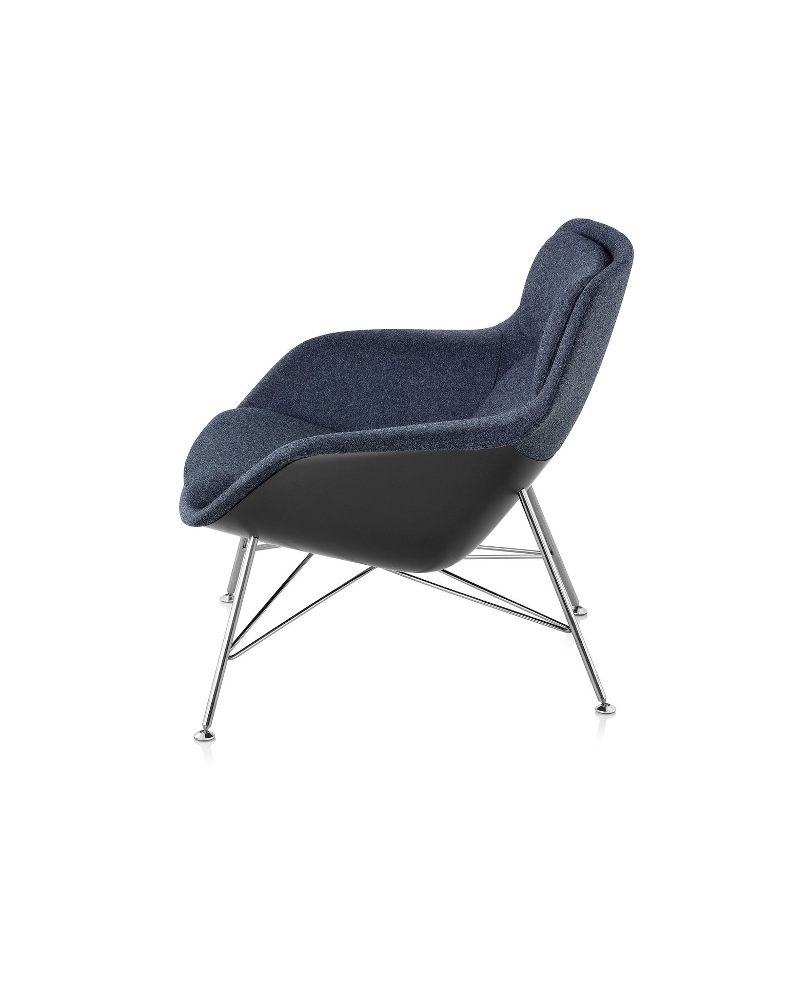A low-back Striad Lounge Chair upholstered in a dark navy textile. Viewed from the side.