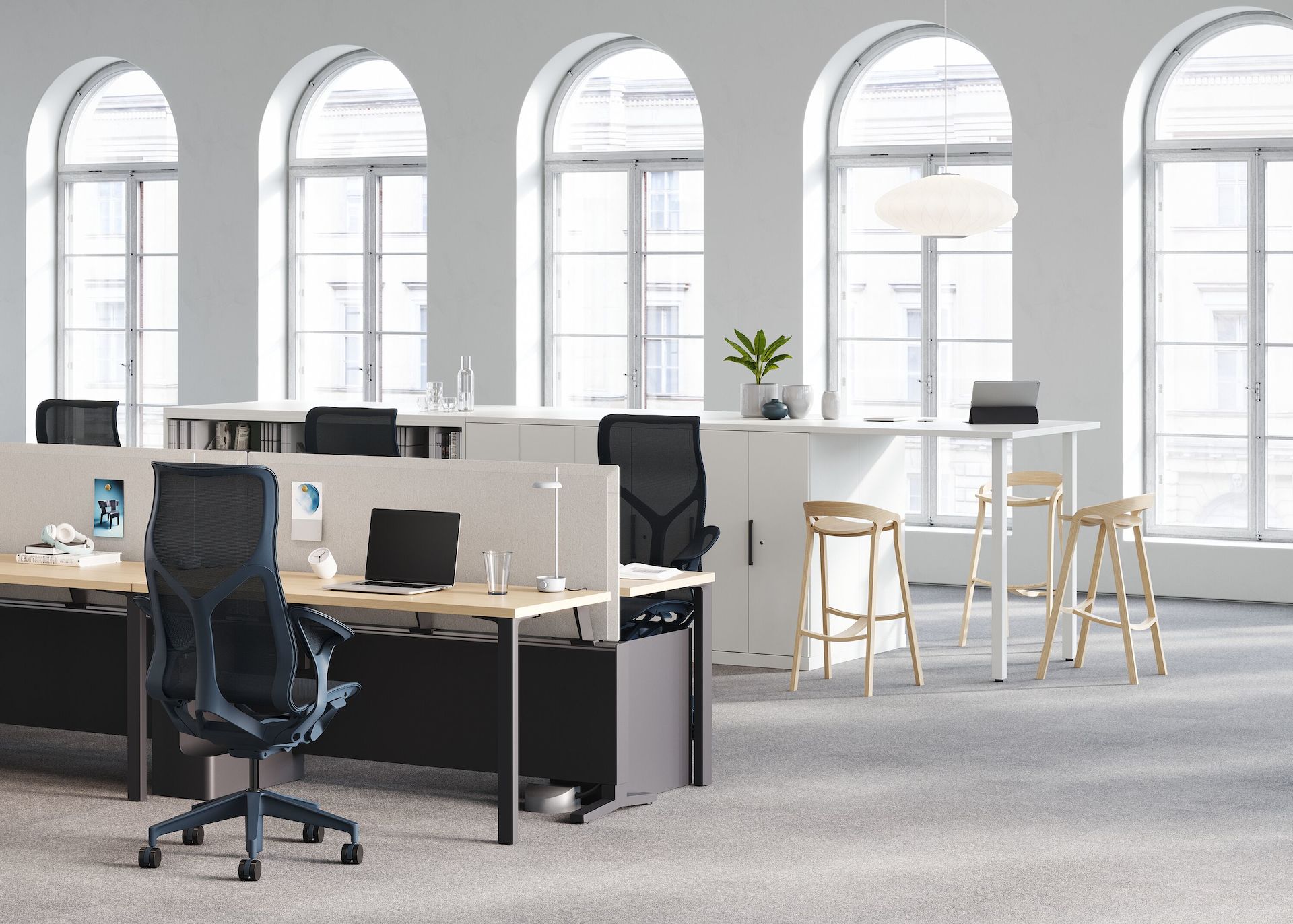 A Canvas Dock workstation, with four high-back Cosm chairs, is a source of power for a Logic Reach round system start.