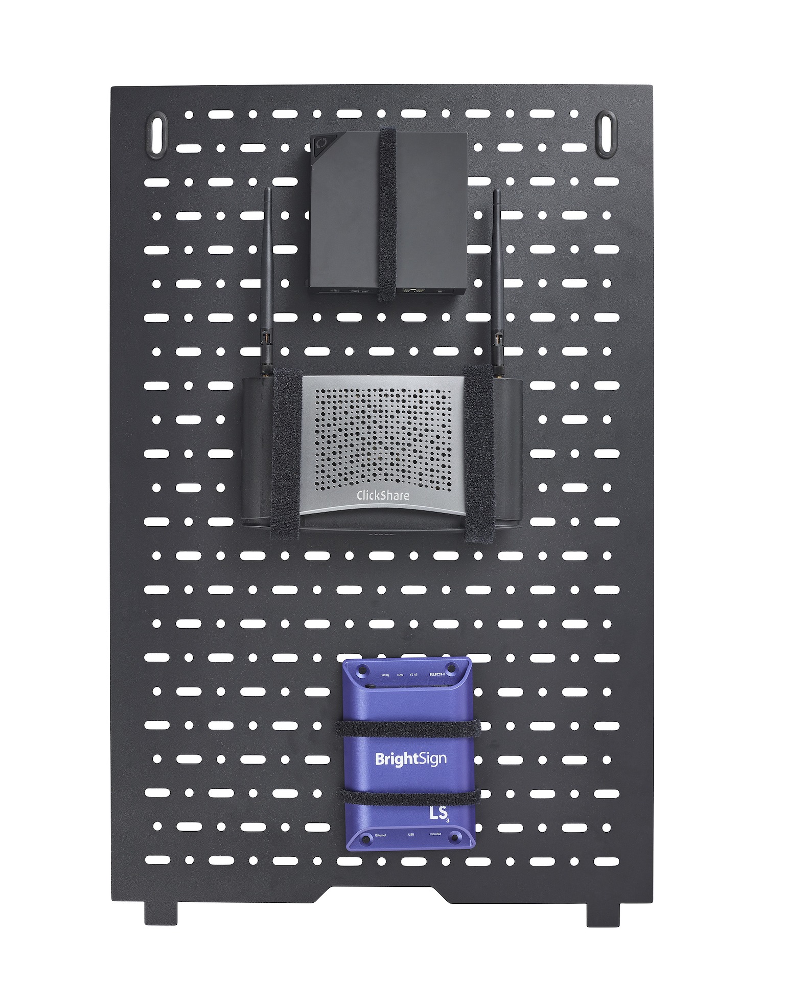 A close up photo of a black perforated panel used to hang technology in a Headway Conference Table.