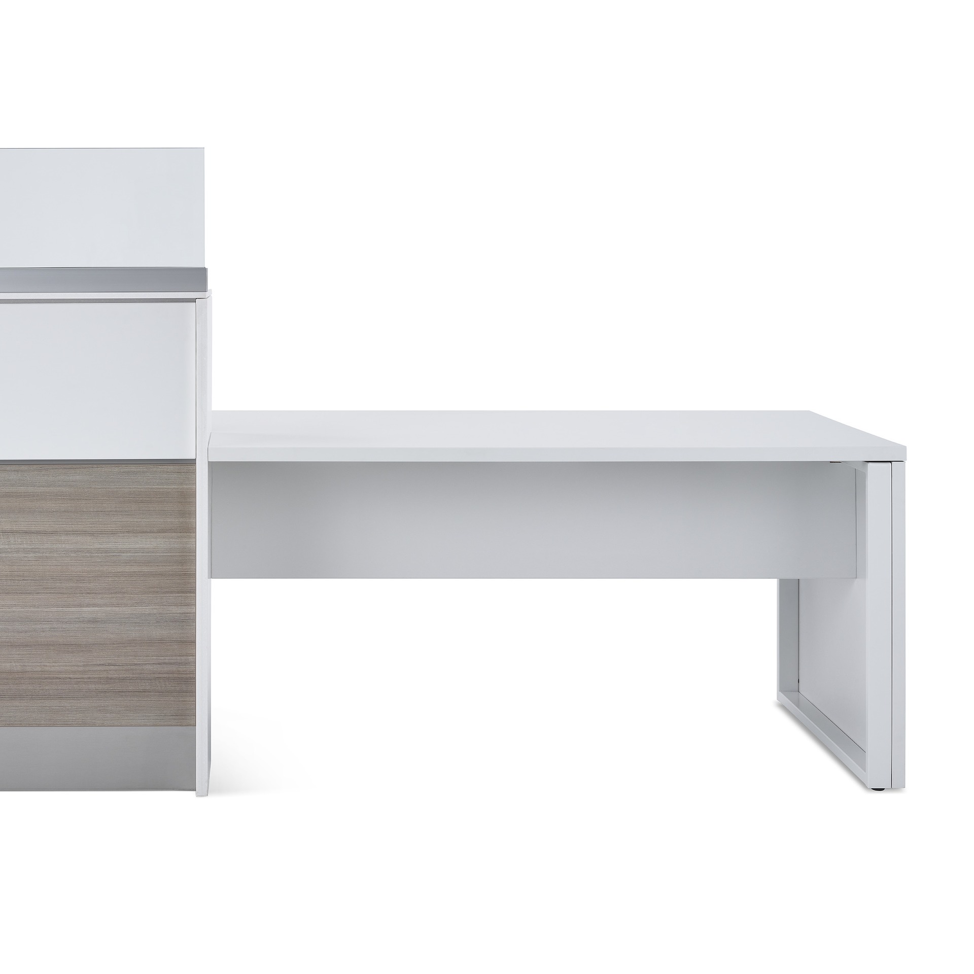 A close-up view of a white laminate modesty panel attached underneath the approach peninsula for the prefab Commend Nurses Station.