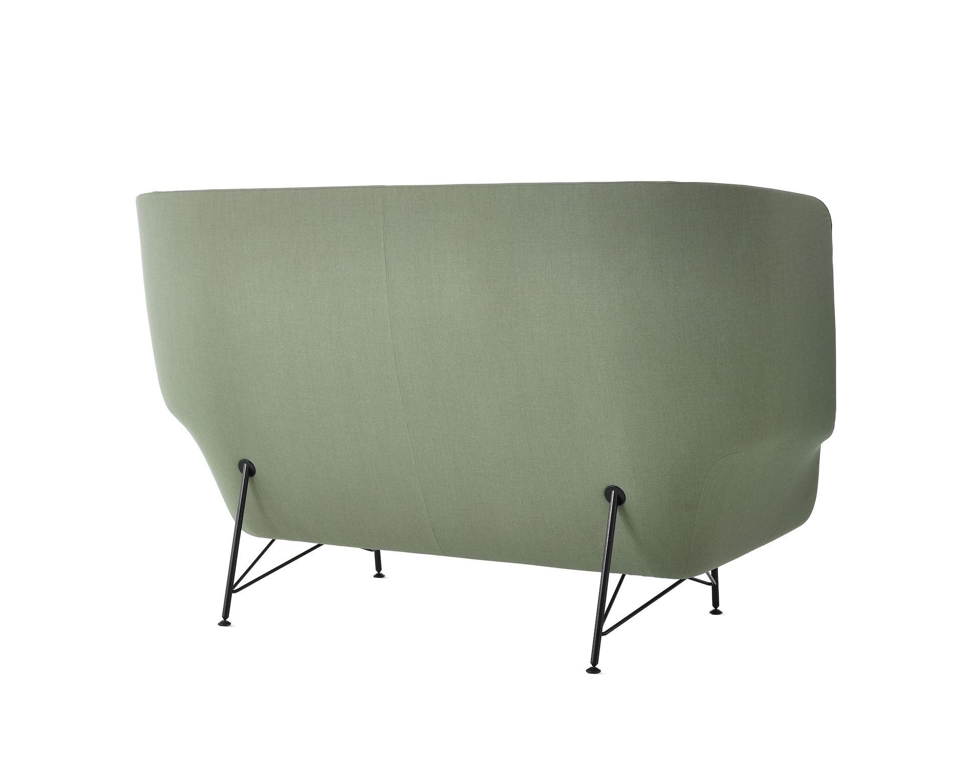 A two-seat, high-back Striad Sofa in green, viewed from the back at an angle.