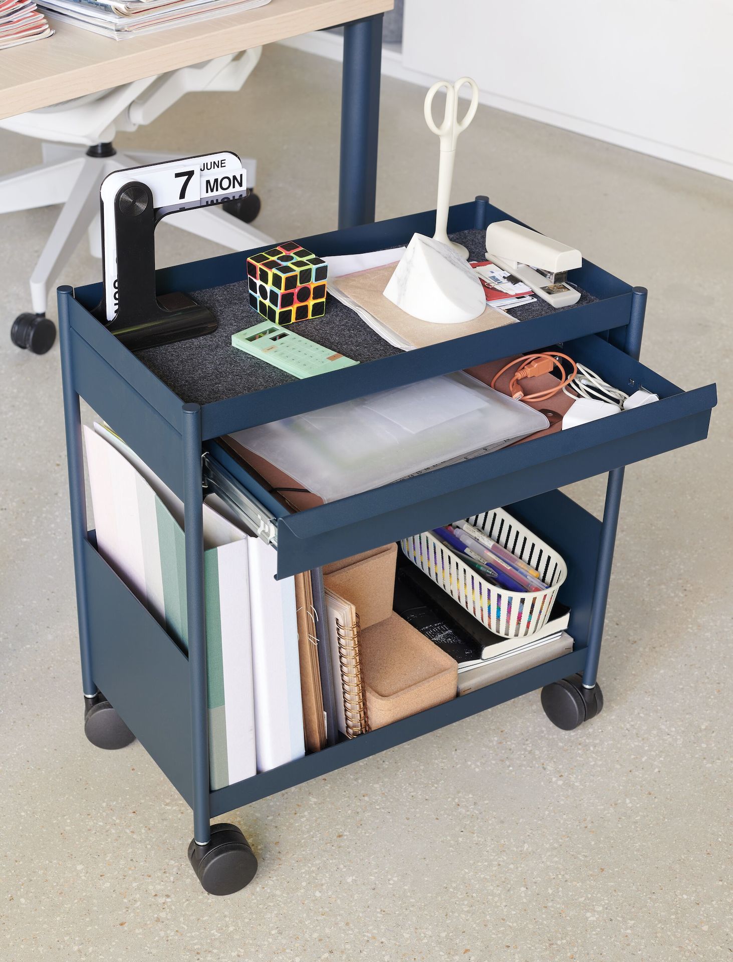 Blue OE1 Storage Trolley with casters in home office setting. 