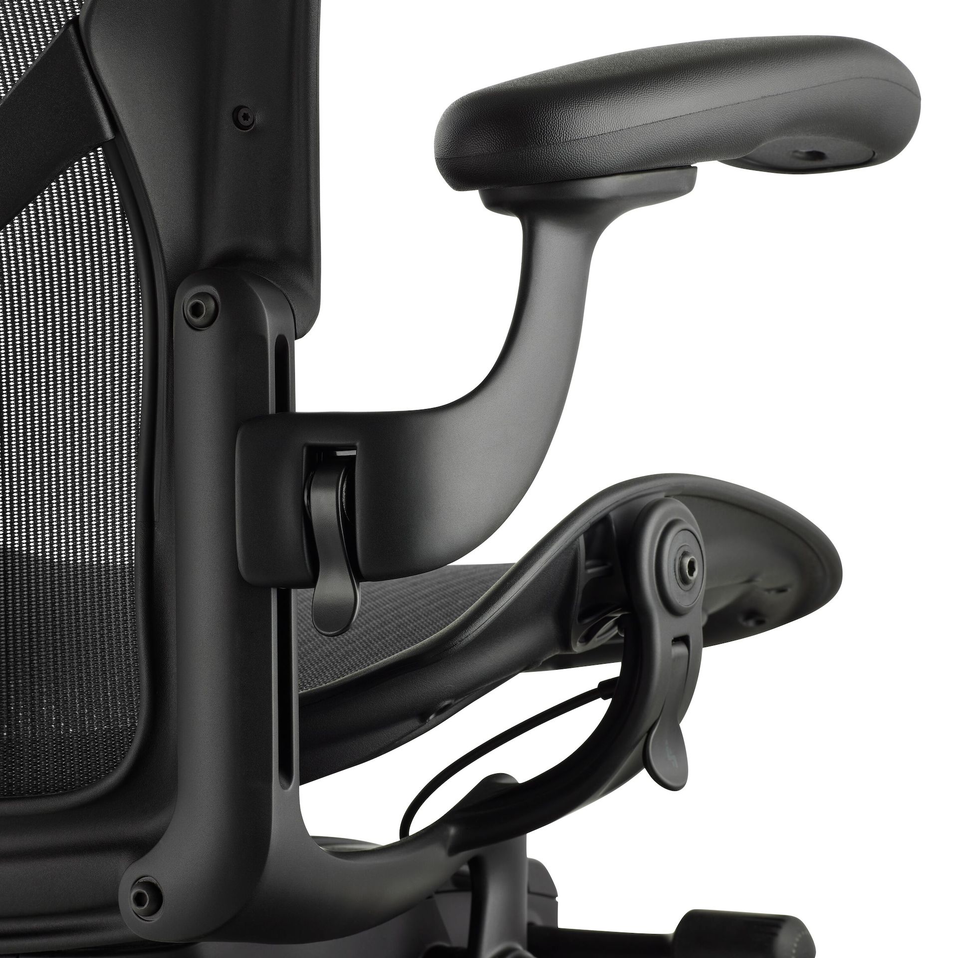 Black matte Aeron Chair on a white background, detailed view of arm height adjustment feature.