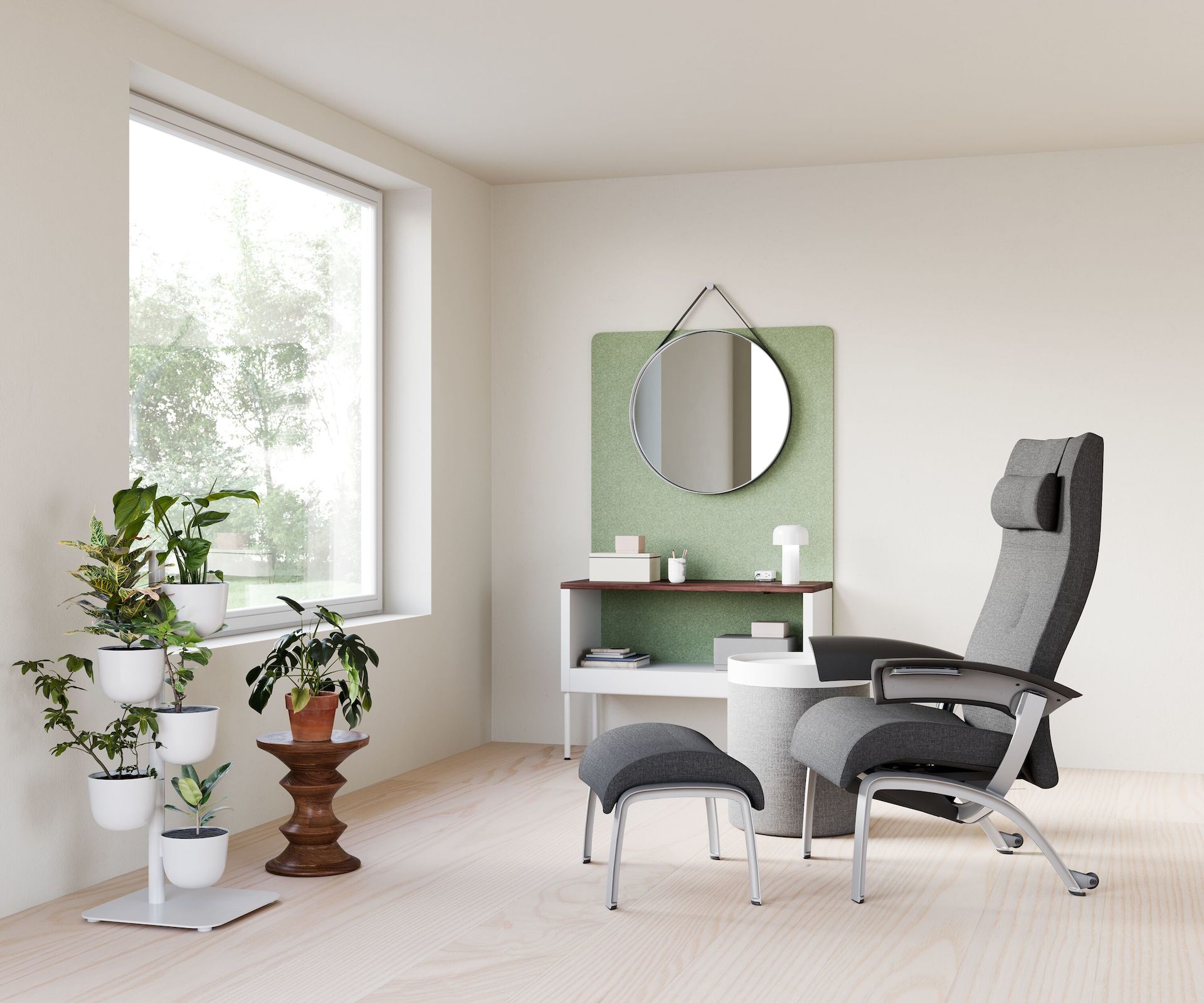 A clinician respite space for one person with a Nemschoff Nala Chair and Ottoman with Public Office Landscape storage bin and screen with a Hay Strap Mirror, with a Eames Walnut Stool, with DWR Drum Pouf and Tray with DWR Story Planter.