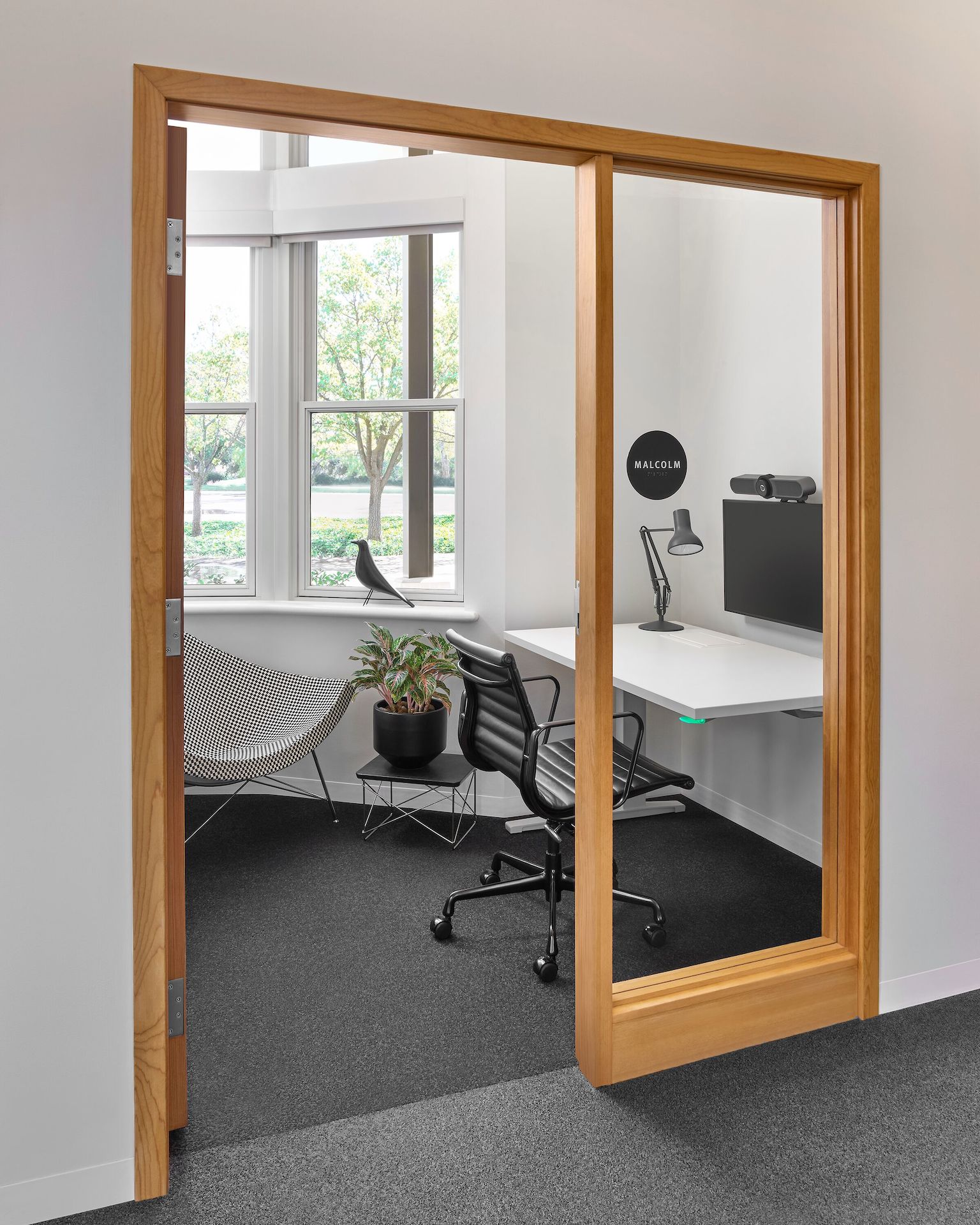 A private office with Renew Rectangular Table next to an Eames Aluminum Group Management Chair.