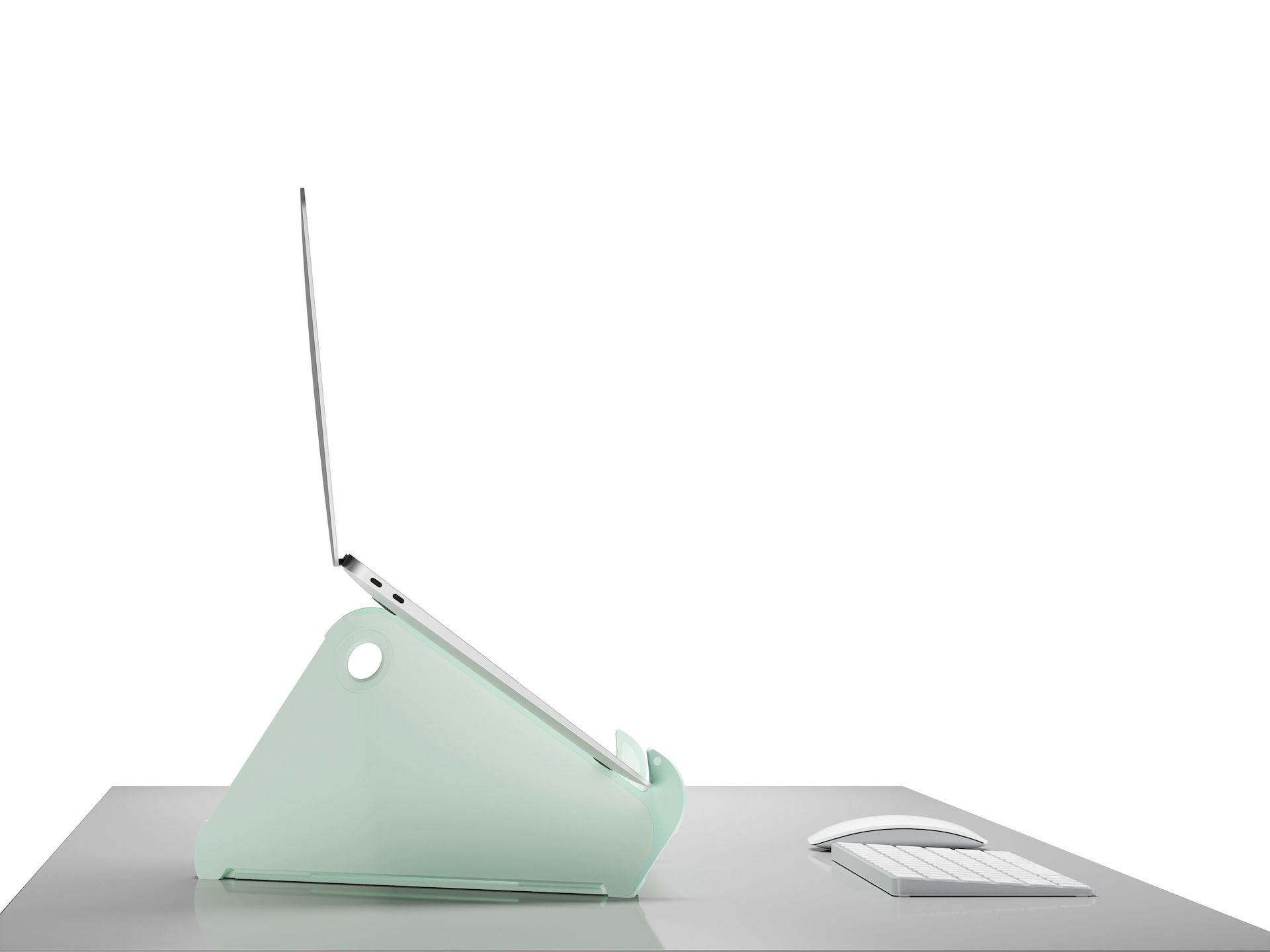Side profile of an open and raised laptop on an Oripura Laptop Stand in mint green.