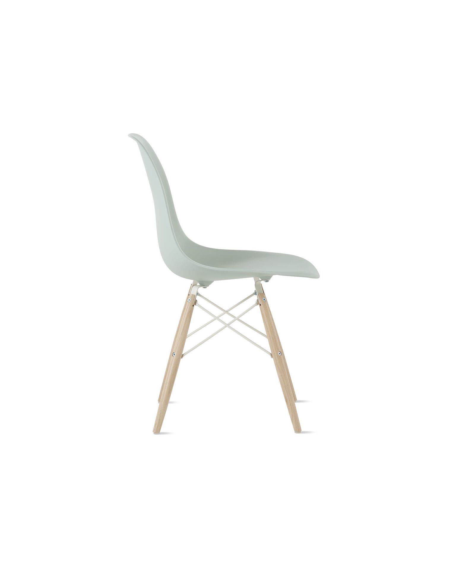 Side view of grey green plastic shell chair with dowel base.