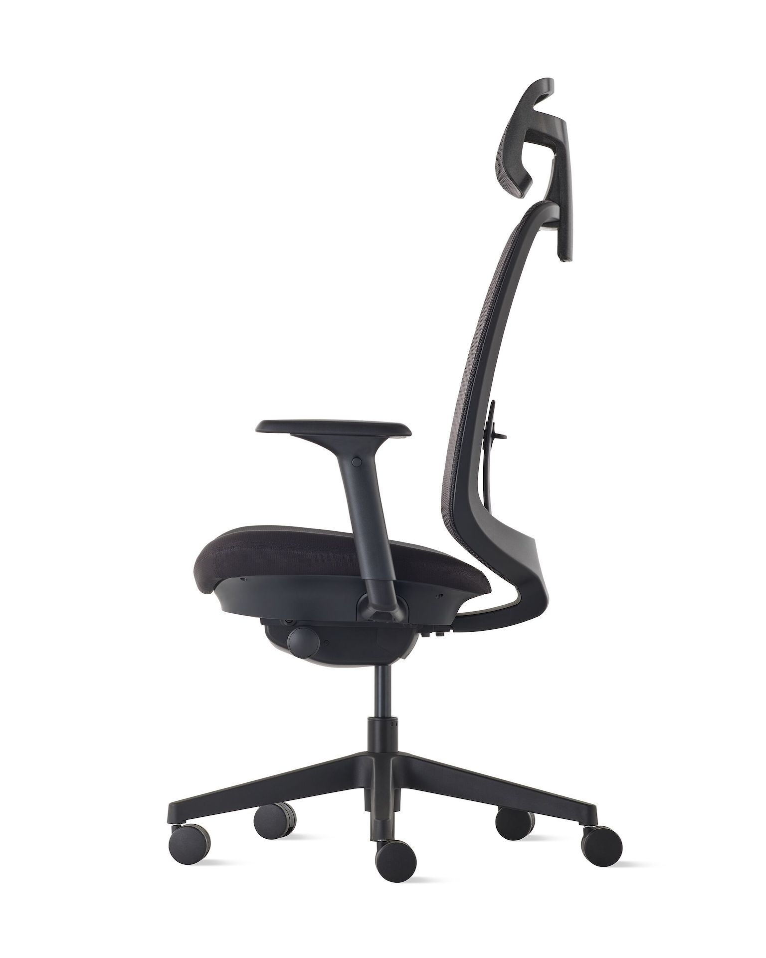 Side view of a Verus chair with a headrest and  black suspension, frame and base.