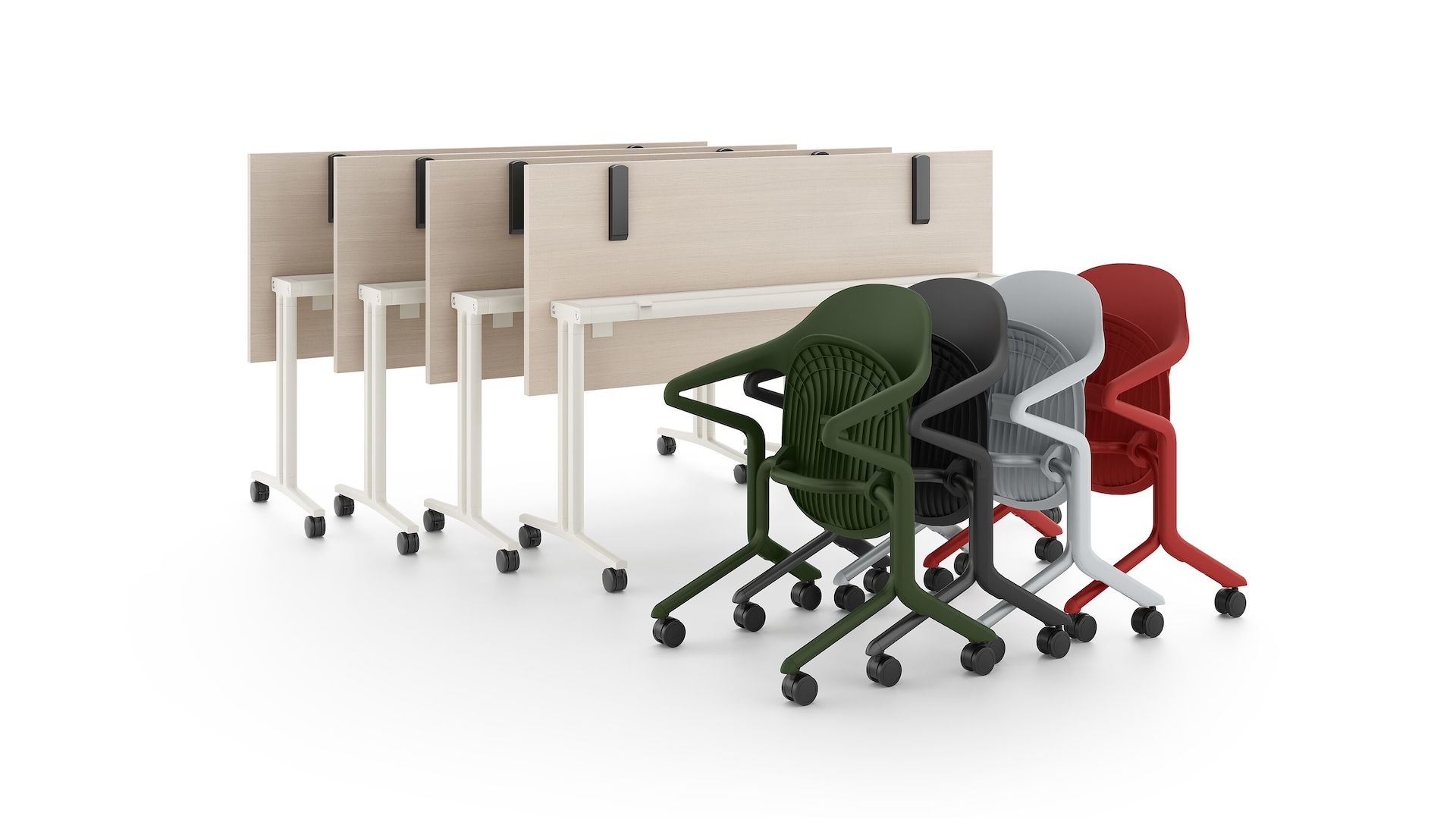 Four Fuld chairs in multiple colors nested together in front of four folded Everywhere tables.