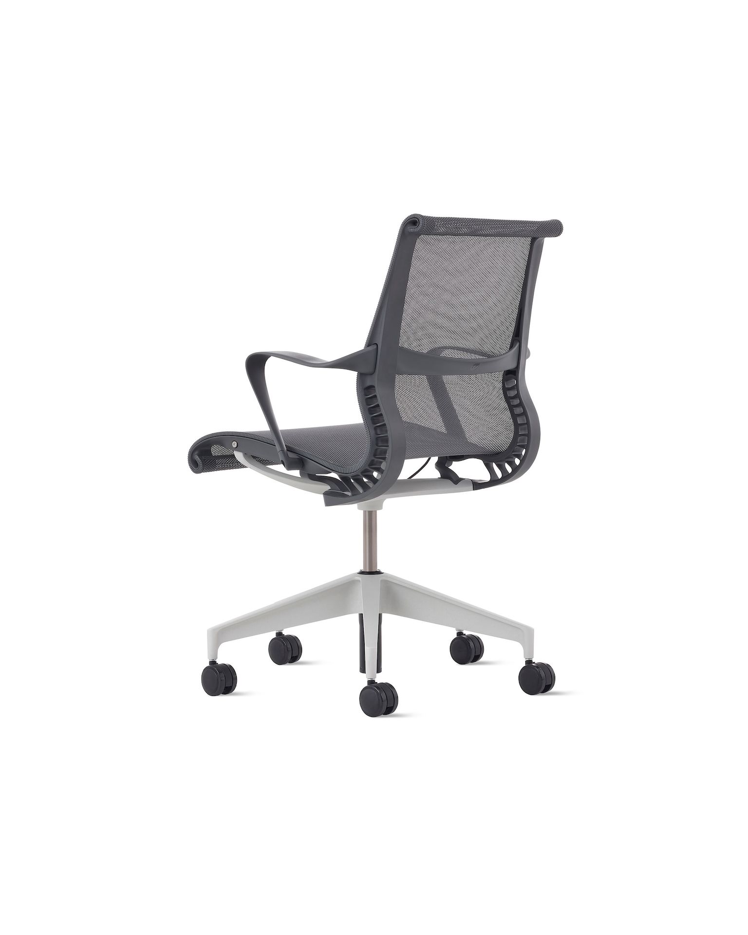 Rear angle view of a Setu chair in grey with a silver alloy base.