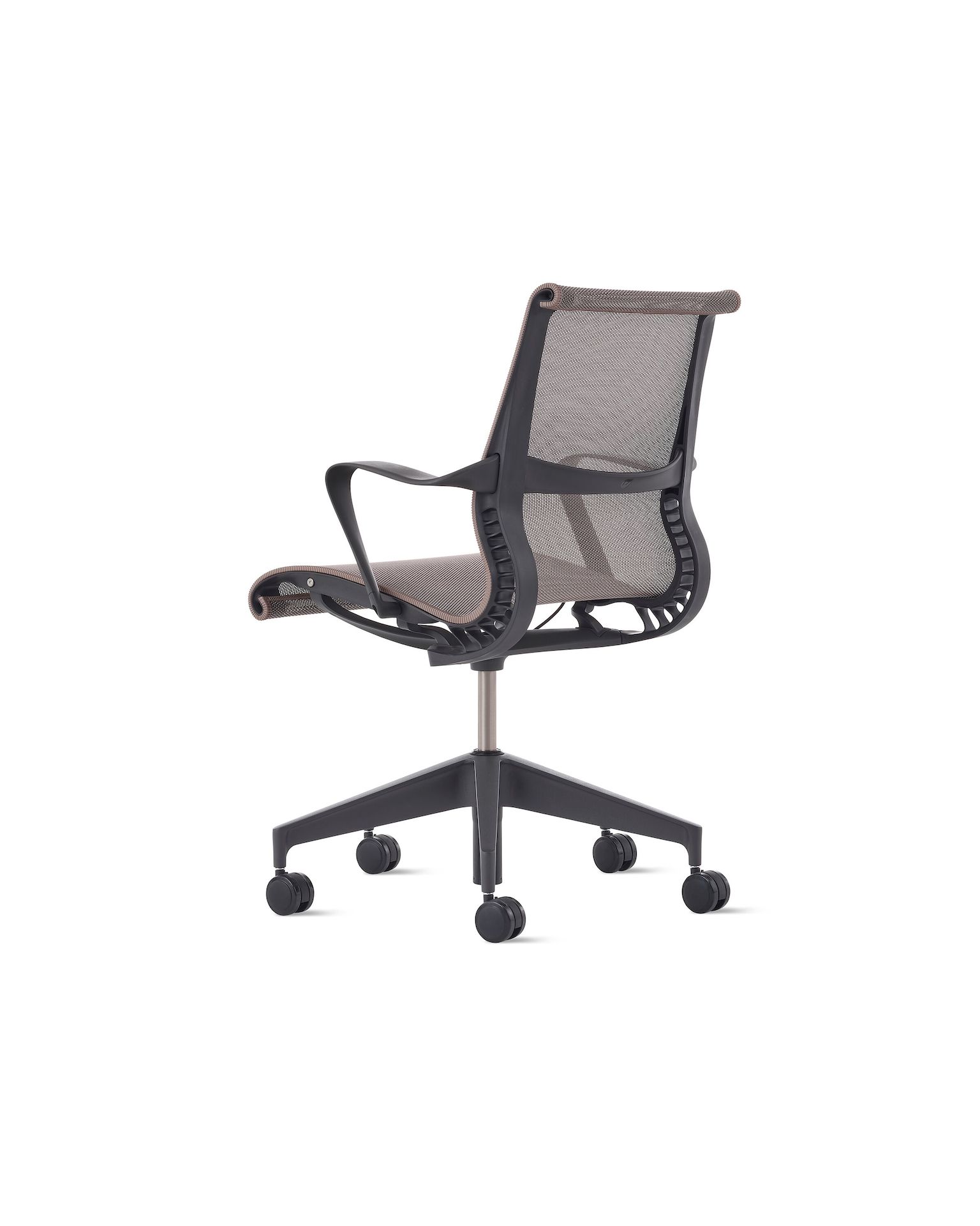 Rear angle view of a Setu chair with fixed arms with a dark grey frame and base with light brown suspension.