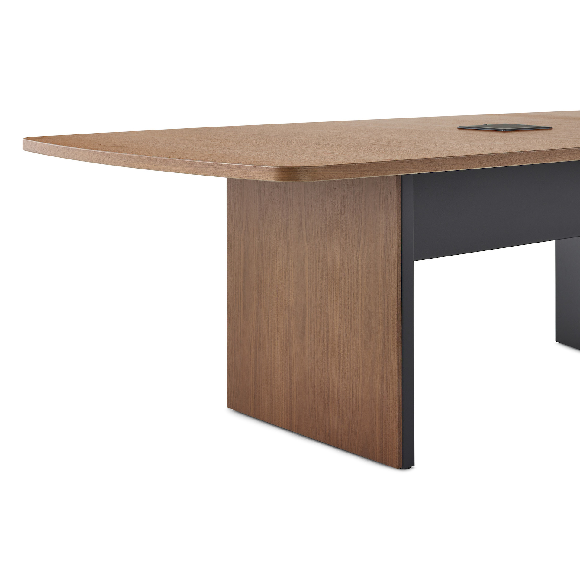 A close up image of a closed cabinet base Headway Conference Table in a walnut wood finish.